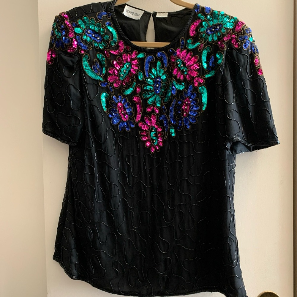 Denise Elle Black Top with Vibrant Sequin Design. Short sleeve. Floral pattern.